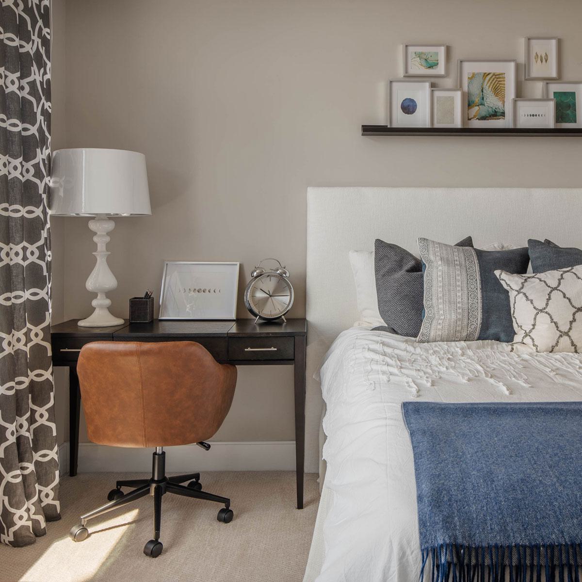 Bedroom with desk next to bed